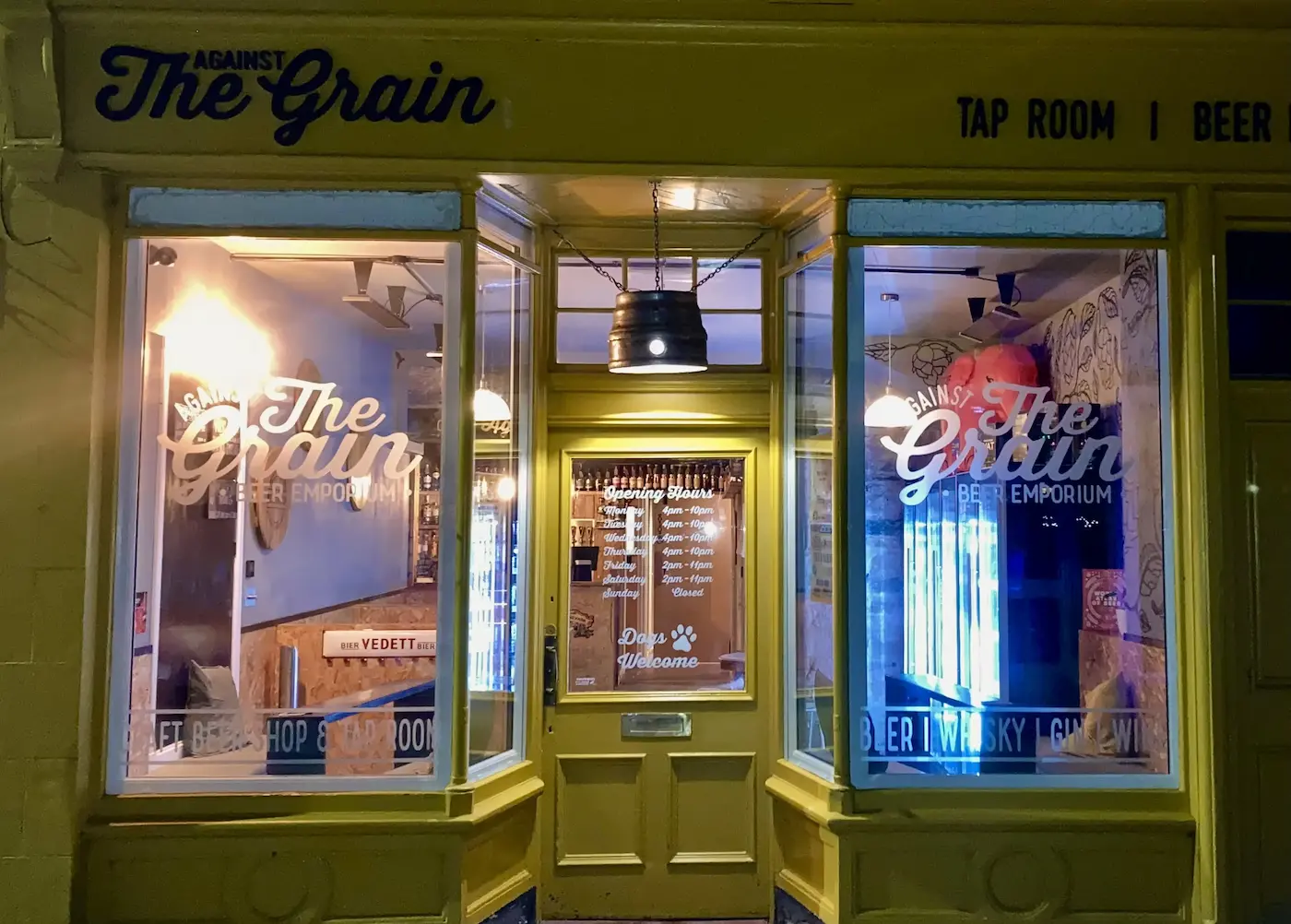 Welcoming, inviting entrance of ATG Beer in Speyside, featuring warm lighting and rustic decor